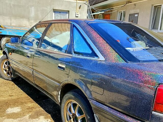 Черный Мазда 626, объемом двигателя 2 л и пробегом 0 тыс. км за 1000 $, фото 1 на Automoto.ua