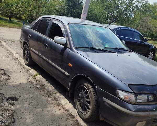 Фиолетовый Мазда 626, объемом двигателя 2 л и пробегом 320 тыс. км за 1200 $, фото 1 на Automoto.ua