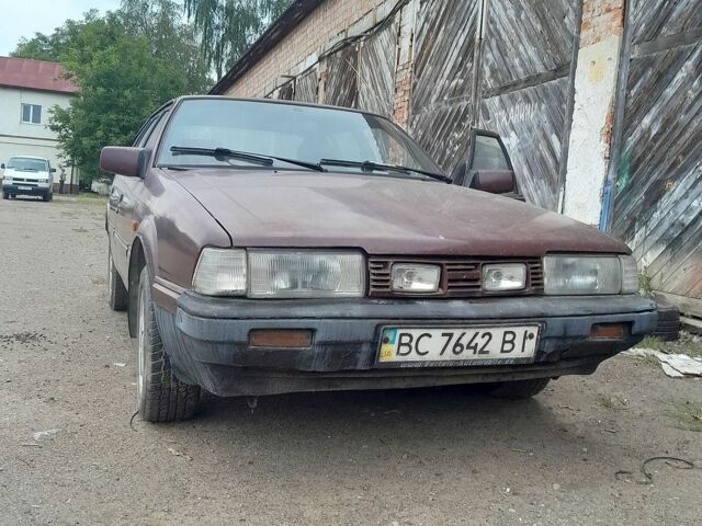 Красный Мазда 626, объемом двигателя 2 л и пробегом 350 тыс. км за 750 $, фото 1 на Automoto.ua