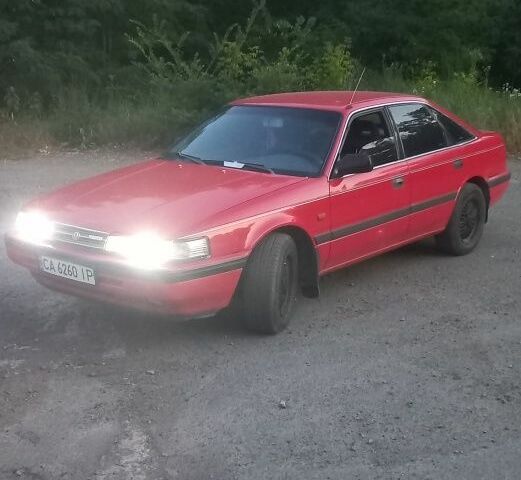 Красный Мазда 626, объемом двигателя 2 л и пробегом 231 тыс. км за 2000 $, фото 1 на Automoto.ua