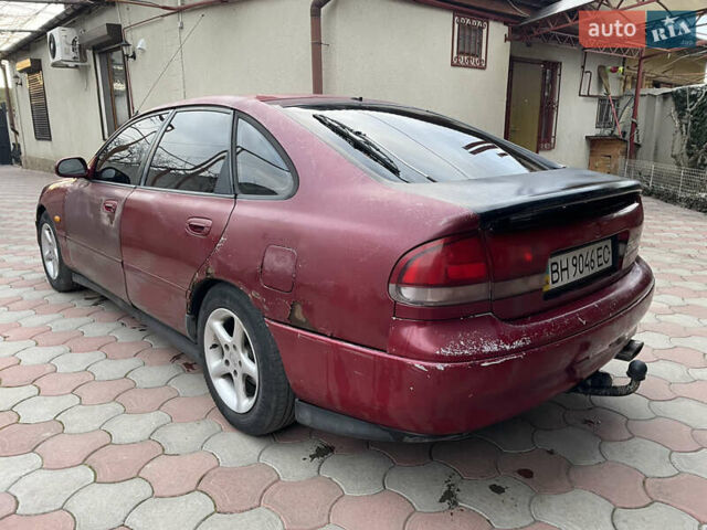 Красный Мазда 626, объемом двигателя 2 л и пробегом 300 тыс. км за 1300 $, фото 1 на Automoto.ua