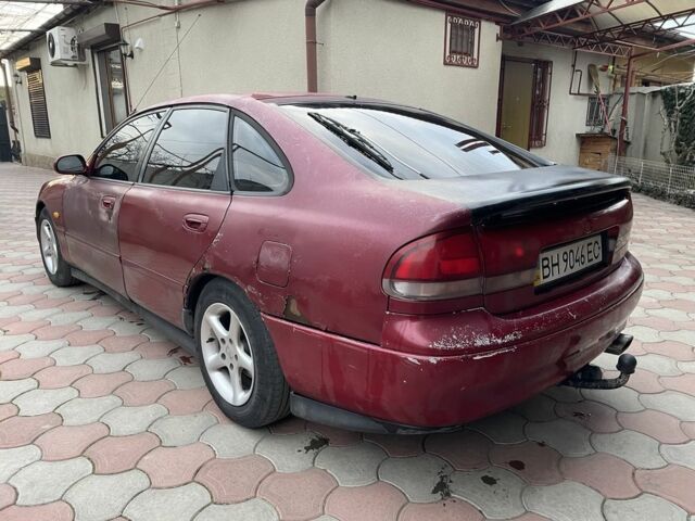 Червоний Мазда 626, об'ємом двигуна 2 л та пробігом 33 тис. км за 1300 $, фото 1 на Automoto.ua