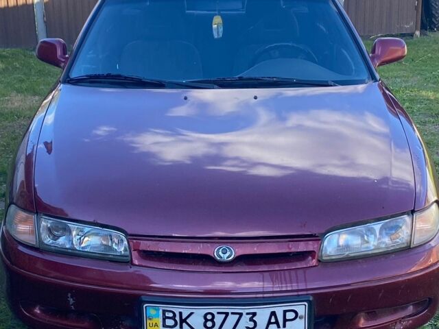 Красный Мазда 626, объемом двигателя 2 л и пробегом 450 тыс. км за 650 $, фото 1 на Automoto.ua
