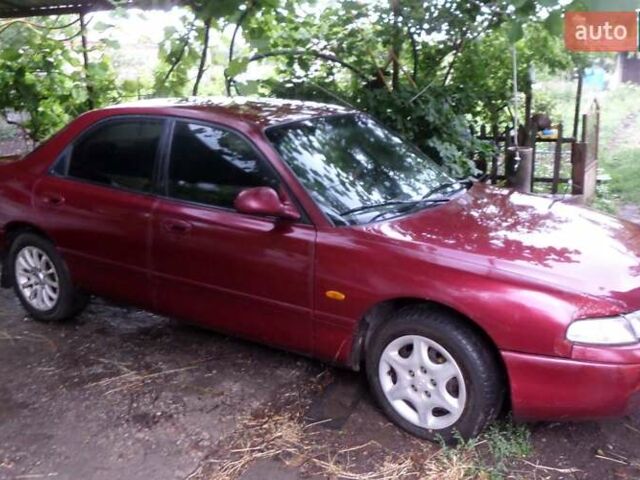 Красный Мазда 626, объемом двигателя 1.8 л и пробегом 250 тыс. км за 928 $, фото 1 на Automoto.ua