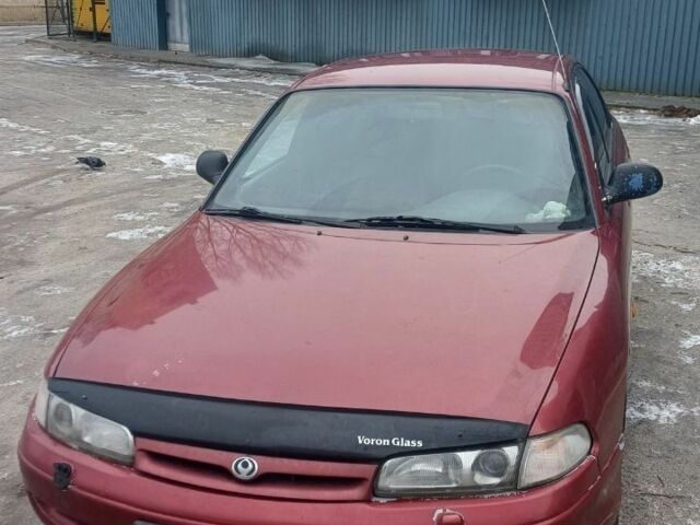 Червоний Мазда 626, об'ємом двигуна 2 л та пробігом 150 тис. км за 2500 $, фото 1 на Automoto.ua