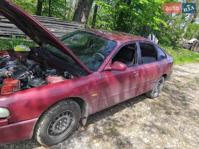 Красный Мазда 626, объемом двигателя 1.8 л и пробегом 100 тыс. км за 1000 $, фото 1 на Automoto.ua