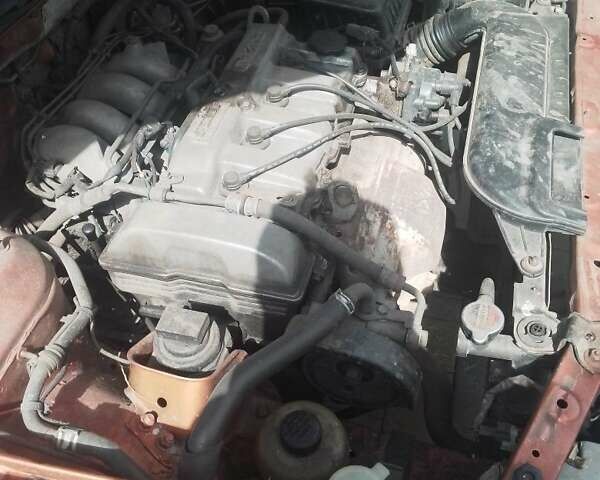 Красный Мазда 626, объемом двигателя 1.8 л и пробегом 294 тыс. км за 1500 $, фото 1 на Automoto.ua