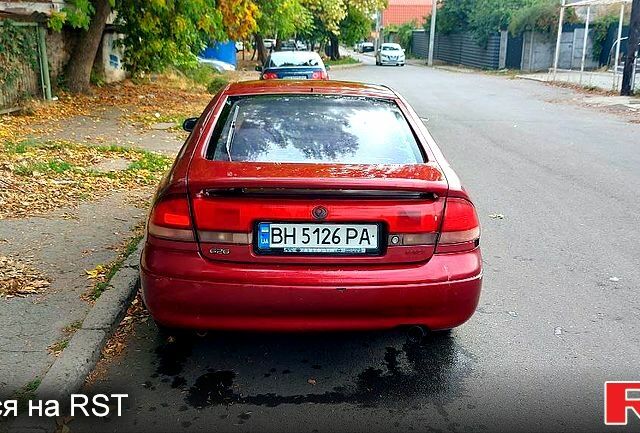Красный Мазда 626, объемом двигателя 2 л и пробегом 320 тыс. км за 1500 $, фото 1 на Automoto.ua