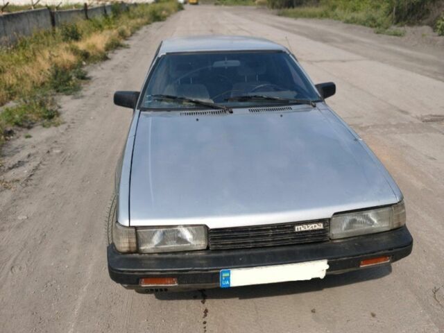 Серый Мазда 626, объемом двигателя 2 л и пробегом 400 тыс. км за 673 $, фото 1 на Automoto.ua