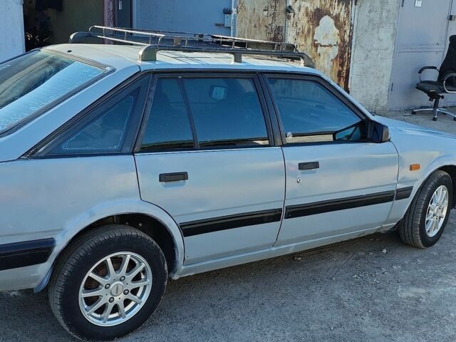 Серый Мазда 626, объемом двигателя 2 л и пробегом 94 тыс. км за 1000 $, фото 1 на Automoto.ua
