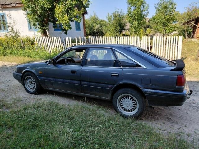 Серый Мазда 626, объемом двигателя 2 л и пробегом 300 тыс. км за 902 $, фото 1 на Automoto.ua