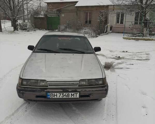 Серый Мазда 626, объемом двигателя 2 л и пробегом 225 тыс. км за 650 $, фото 1 на Automoto.ua