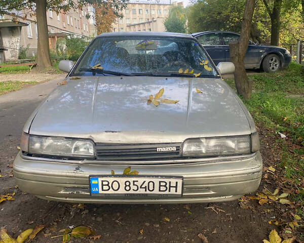 Серый Мазда 626, объемом двигателя 2 л и пробегом 355 тыс. км за 1000 $, фото 1 на Automoto.ua