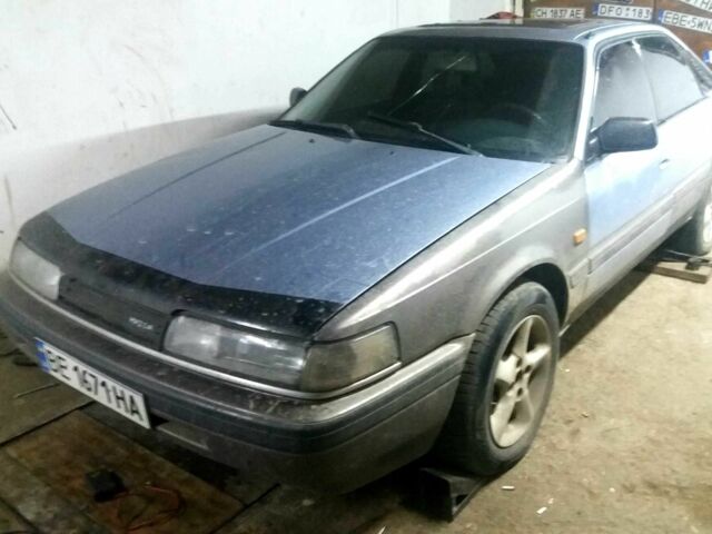 Серый Мазда 626, объемом двигателя 1.8 л и пробегом 400 тыс. км за 1050 $, фото 1 на Automoto.ua