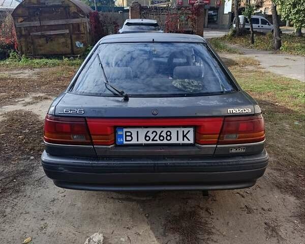 Серый Мазда 626, объемом двигателя 2 л и пробегом 430 тыс. км за 1200 $, фото 1 на Automoto.ua