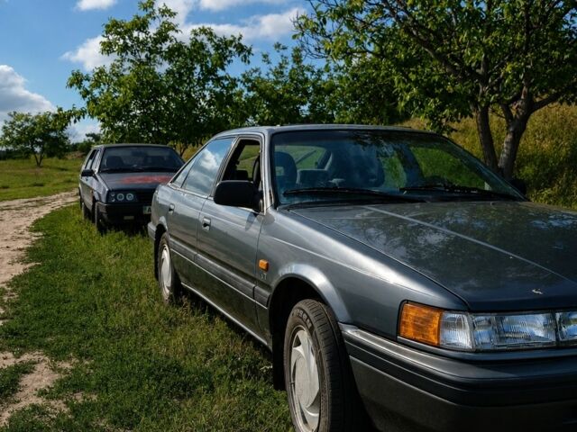 Серый Мазда 626, объемом двигателя 2 л и пробегом 265 тыс. км за 895 $, фото 1 на Automoto.ua