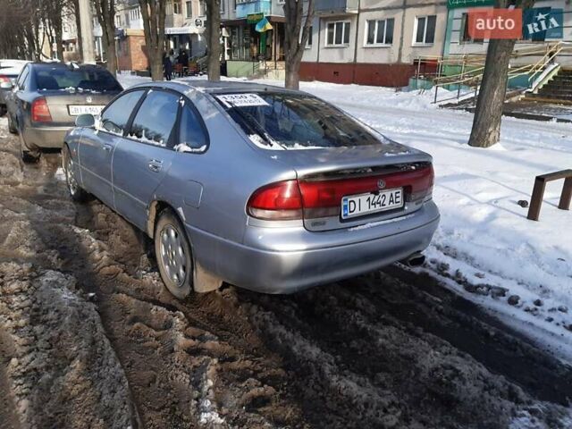 Серый Мазда 626, объемом двигателя 2.5 л и пробегом 300 тыс. км за 1350 $, фото 1 на Automoto.ua