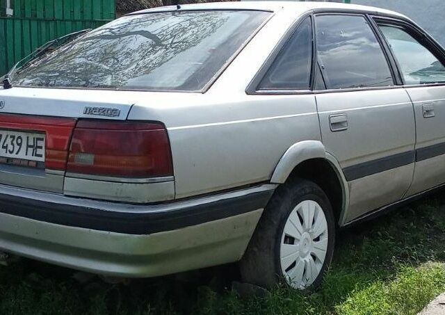 Серый Мазда 626, объемом двигателя 2 л и пробегом 500 тыс. км за 896 $, фото 1 на Automoto.ua