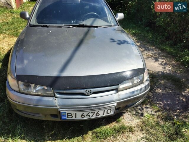 Серый Мазда 626, объемом двигателя 2 л и пробегом 243 тыс. км за 1000 $, фото 1 на Automoto.ua