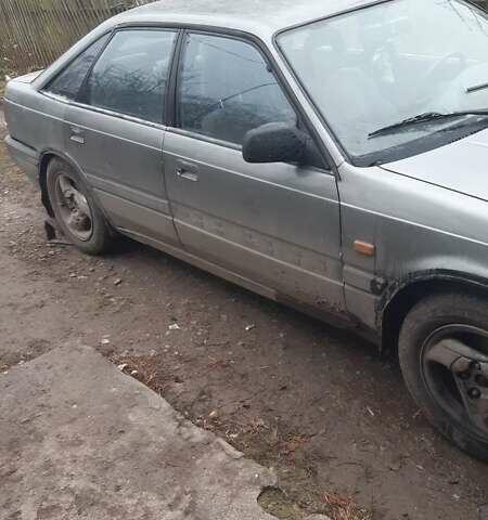 Серый Мазда 626, объемом двигателя 2 л и пробегом 200 тыс. км за 600 $, фото 1 на Automoto.ua