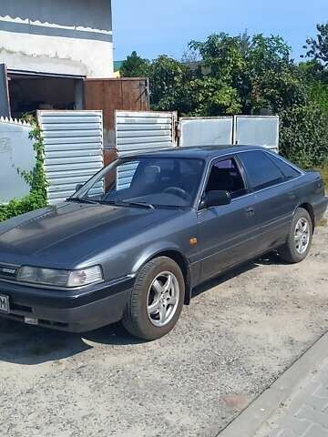 Серый Мазда 626, объемом двигателя 2 л и пробегом 300 тыс. км за 1900 $, фото 1 на Automoto.ua