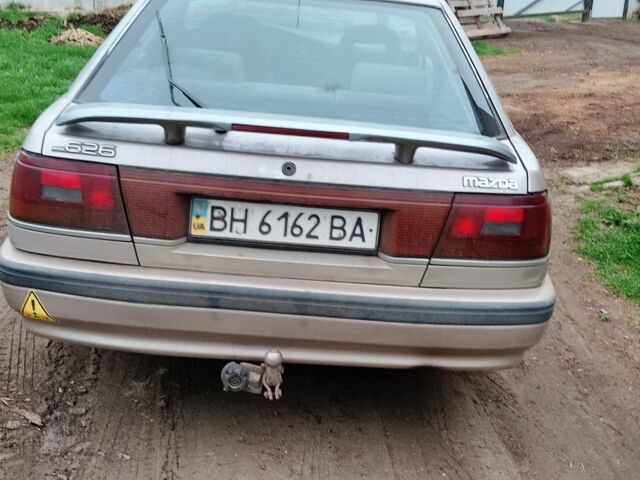Серый Мазда 626, объемом двигателя 2 л и пробегом 350 тыс. км за 600 $, фото 1 на Automoto.ua