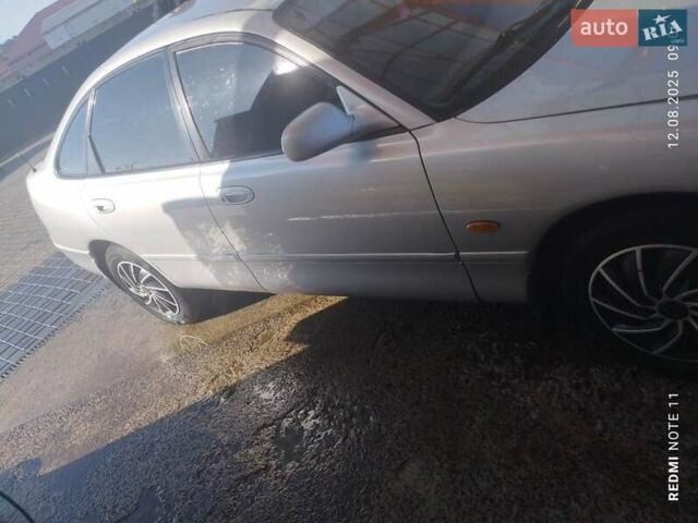 Серый Мазда 626, объемом двигателя 2 л и пробегом 121 тыс. км за 1999 $, фото 1 на Automoto.ua