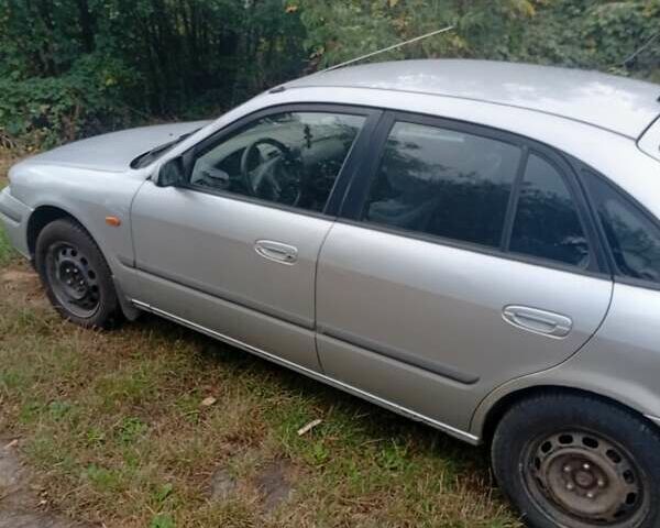 Серый Мазда 626, объемом двигателя 2 л и пробегом 250 тыс. км за 1999 $, фото 1 на Automoto.ua
