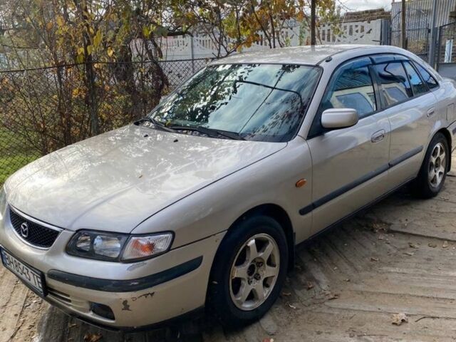 Серый Мазда 626, объемом двигателя 2 л и пробегом 312 тыс. км за 3399 $, фото 1 на Automoto.ua