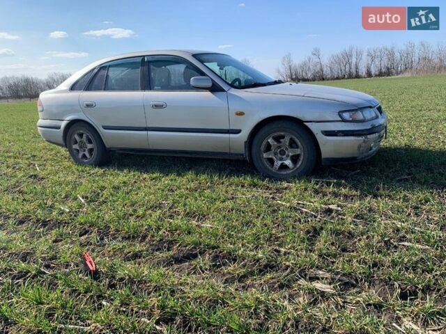 Серый Мазда 626, объемом двигателя 2 л и пробегом 312 тыс. км за 2800 $, фото 1 на Automoto.ua