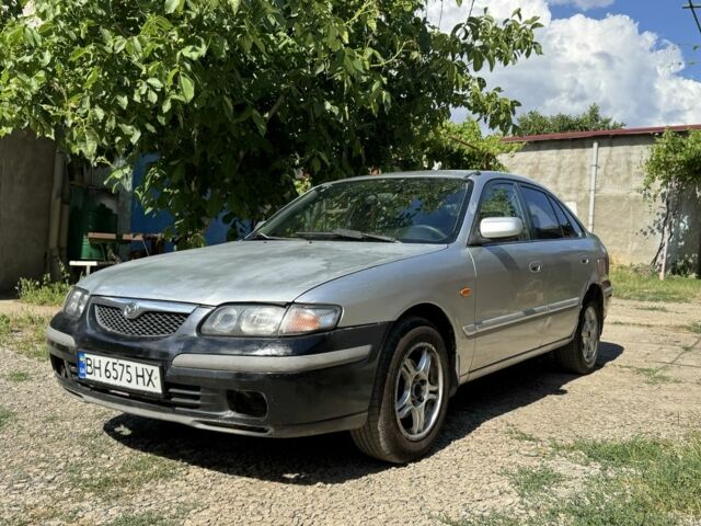 Серый Мазда 626, объемом двигателя 2 л и пробегом 222 тыс. км за 1200 $, фото 1 на Automoto.ua