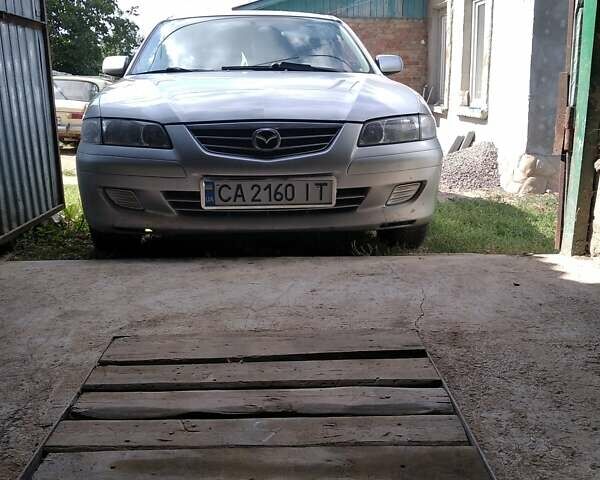 Серый Мазда 626, объемом двигателя 2 л и пробегом 450 тыс. км за 3200 $, фото 1 на Automoto.ua