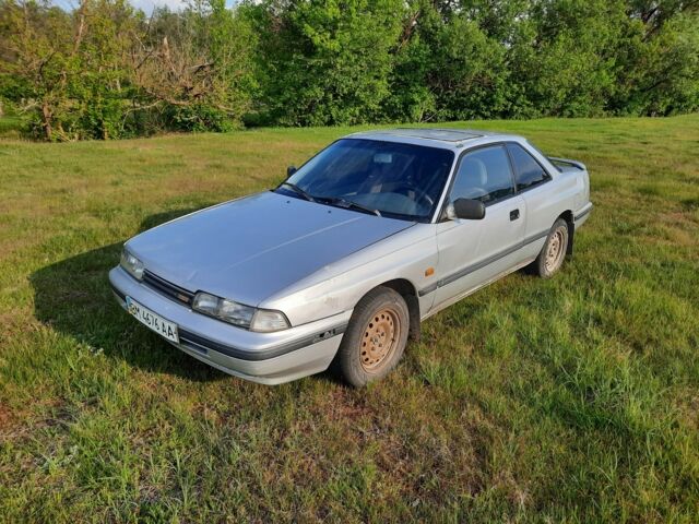 Серый Мазда 626, объемом двигателя 2 л и пробегом 439 тыс. км за 700 $, фото 1 на Automoto.ua