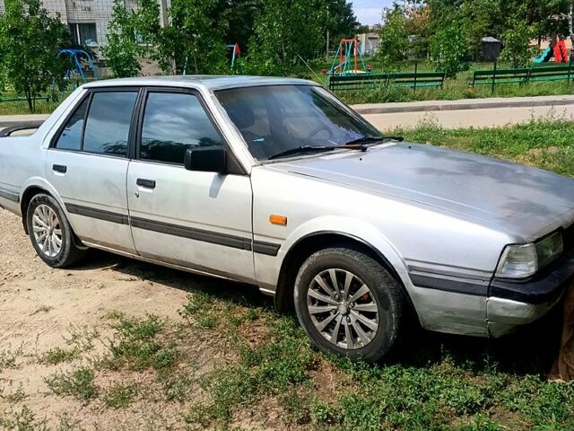 Серый Мазда 626, объемом двигателя 2 л и пробегом 200 тыс. км за 1000 $, фото 1 на Automoto.ua