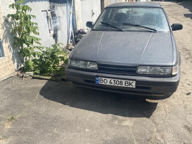 Серый Мазда 626, объемом двигателя 2 л и пробегом 300 тыс. км за 900 $, фото 1 на Automoto.ua