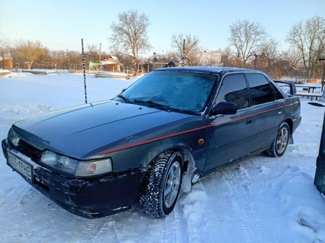 Серый Мазда 626, объемом двигателя 2 л и пробегом 1000 тыс. км за 600 $, фото 1 на Automoto.ua