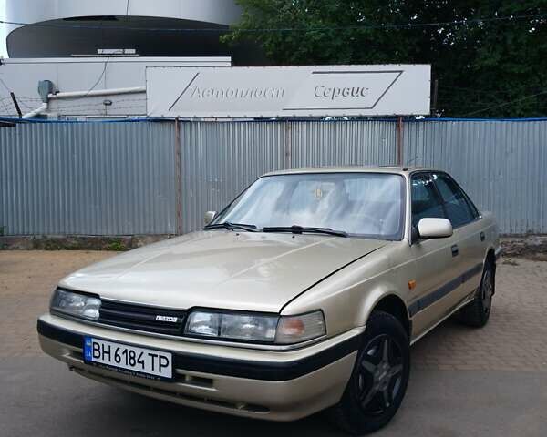 Серый Мазда 626, объемом двигателя 2 л и пробегом 400 тыс. км за 1299 $, фото 1 на Automoto.ua