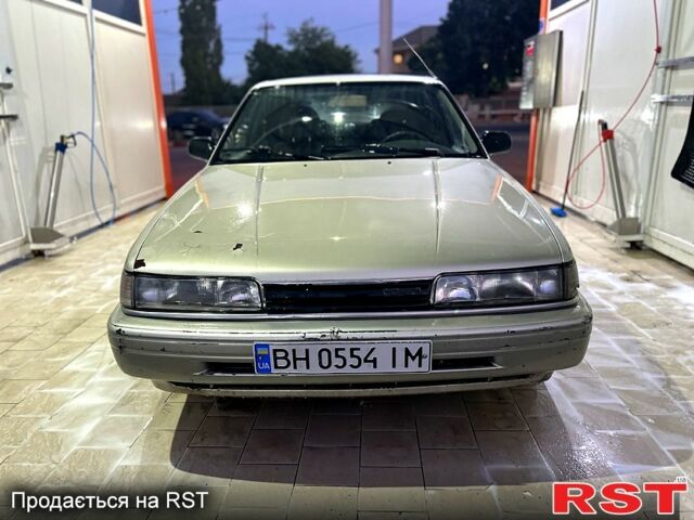 Серый Мазда 626, объемом двигателя 2 л и пробегом 250 тыс. км за 1250 $, фото 1 на Automoto.ua