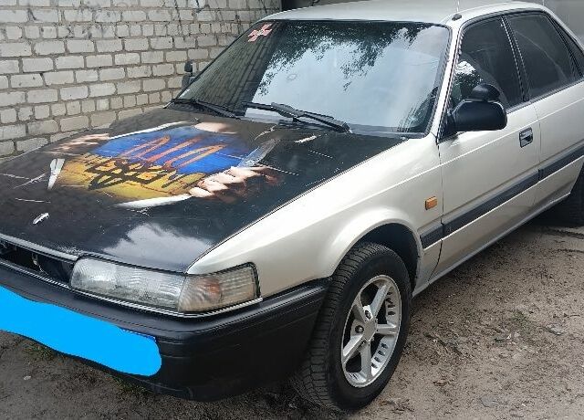 Серый Мазда 626, объемом двигателя 2 л и пробегом 400 тыс. км за 961 $, фото 1 на Automoto.ua