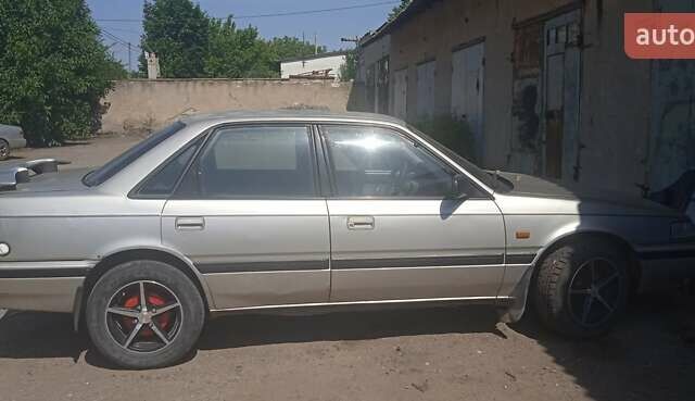 Сірий Мазда 626, об'ємом двигуна 1.8 л та пробігом 50 тис. км за 1300 $, фото 1 на Automoto.ua