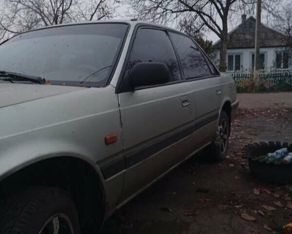 Серый Мазда 626, объемом двигателя 1.8 л и пробегом 594 тыс. км за 953 $, фото 1 на Automoto.ua