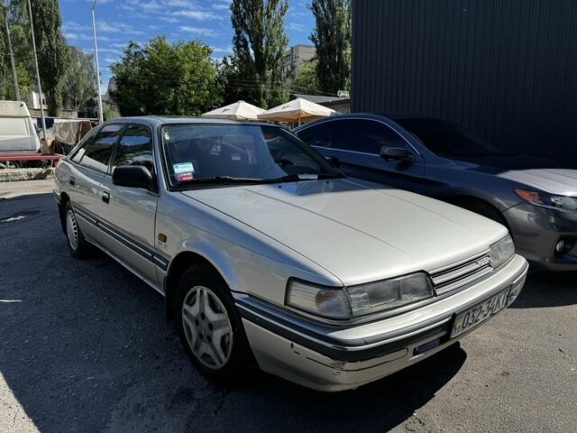 Серый Мазда 626, объемом двигателя 2 л и пробегом 273 тыс. км за 750 $, фото 1 на Automoto.ua