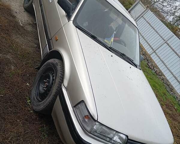 Серый Мазда 626, объемом двигателя 2 л и пробегом 550 тыс. км за 1400 $, фото 1 на Automoto.ua