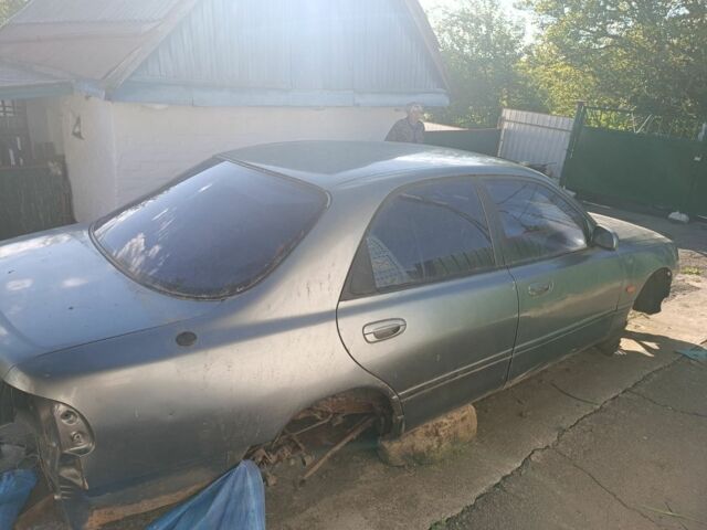 Серый Мазда 626, объемом двигателя 2 л и пробегом 200 тыс. км за 700 $, фото 1 на Automoto.ua