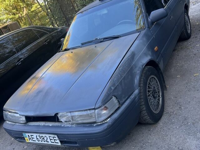 Серый Мазда 626, объемом двигателя 2 л и пробегом 200 тыс. км за 802 $, фото 1 на Automoto.ua