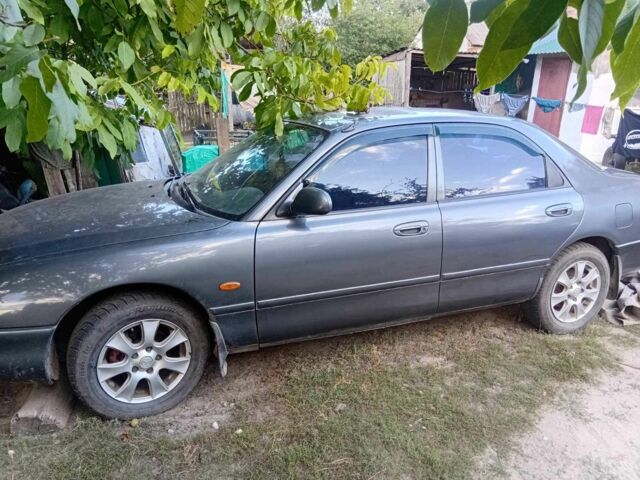 Сірий Мазда 626, об'ємом двигуна 2 л та пробігом 287 тис. км за 1999 $, фото 1 на Automoto.ua