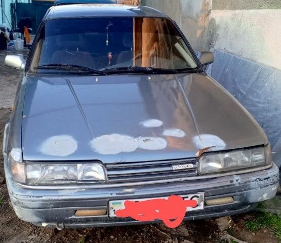 Серый Мазда 626, объемом двигателя 2 л и пробегом 300 тыс. км за 450 $, фото 1 на Automoto.ua