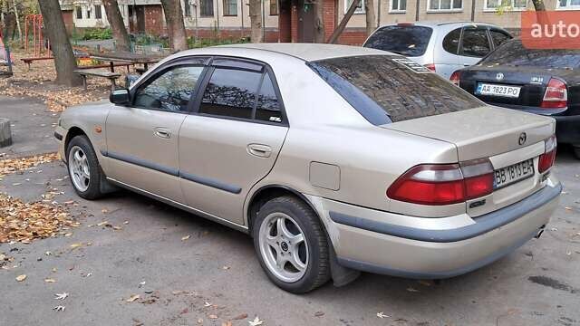 Серый Мазда 626, объемом двигателя 1.8 л и пробегом 320 тыс. км за 3300 $, фото 1 на Automoto.ua