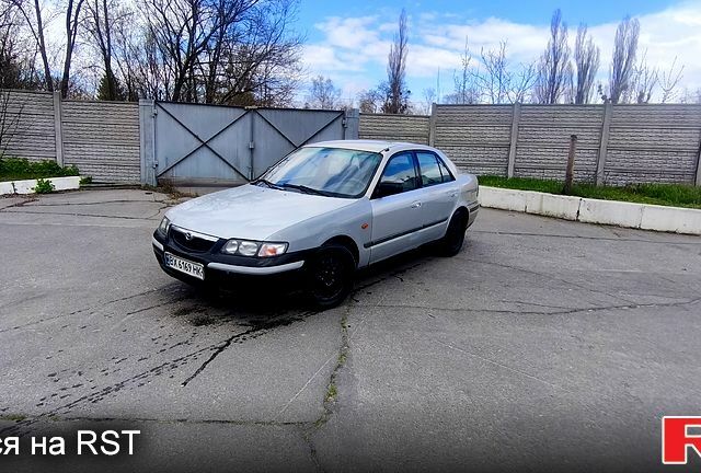Серый Мазда 626, объемом двигателя 2 л и пробегом 400 тыс. км за 1349 $, фото 1 на Automoto.ua