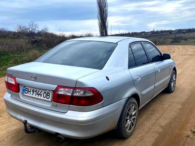 Серый Мазда 626, объемом двигателя 2 л и пробегом 301 тыс. км за 2750 $, фото 1 на Automoto.ua